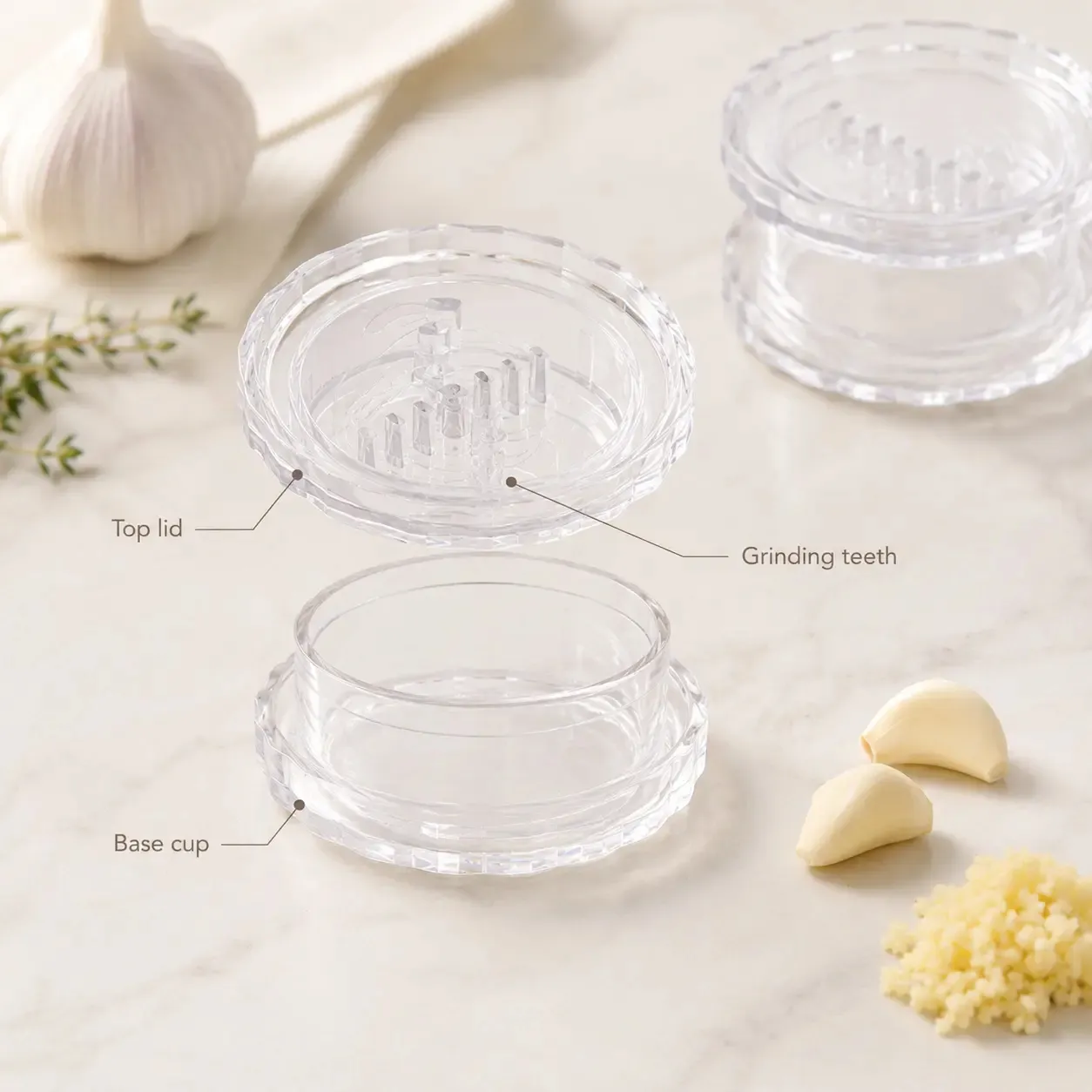 Garlic twister product breakdown showing top lid, grinding teeth, and base cup